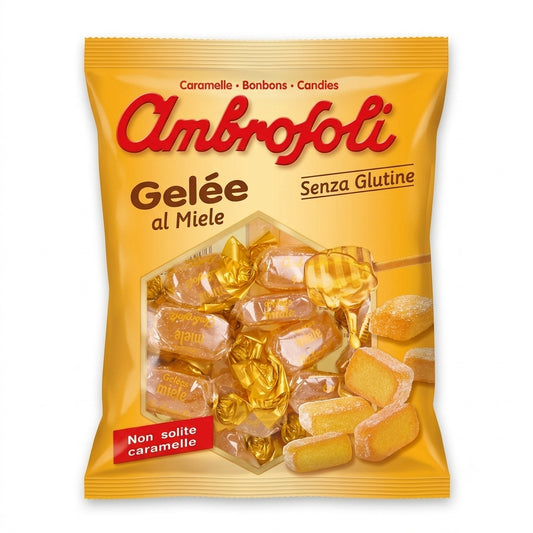 Confezione gialla di Gelée al Miele Ambrofoli con caramelle incartate e caramelle morbide scoperte su sfondo bianco