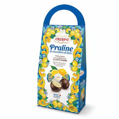 Confezione regalo con manico da 200g di praline di cioccolato al latte Crispo al gusto limone con grafica decorata a tema agrumi su sfondo bianco