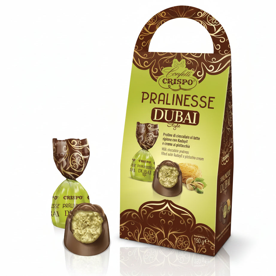 Confezione regalo con manico da 150g di praline di cioccolato al latte Crispo Pralinesse Dubai Style con ripieno di Kadayıf e crema al pistacchio su sfondo bianco