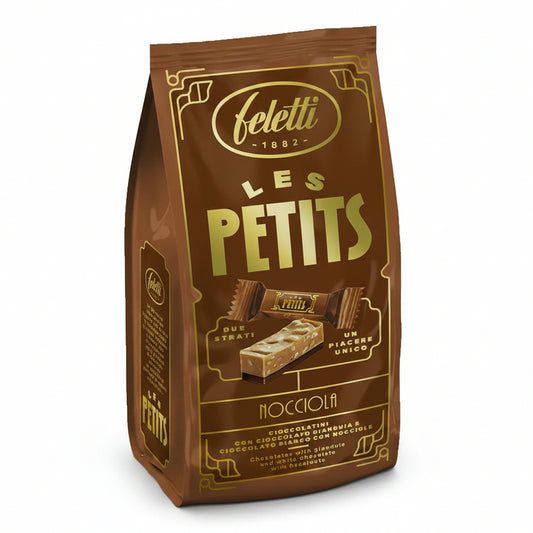 Confezione marrone e oro di cioccolatini Feletti Les Petits Nocciola con grafica dei due strati di cioccolato gianduja e bianco con nocciole su sfondo bianco