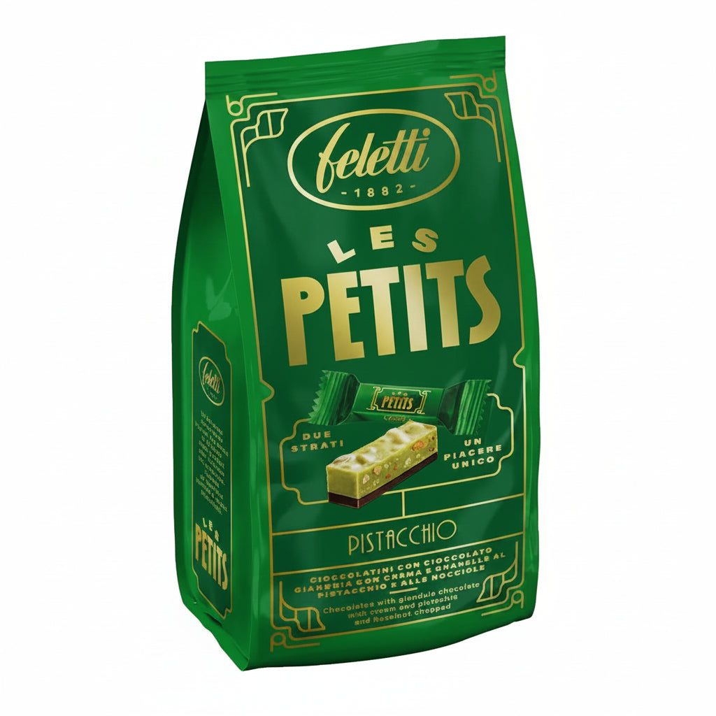 Confezione verde e oro di cioccolatini Feletti Les Petits Pistacchio con grafica dei due strati di cioccolato gianduja, crema al pistacchio e granella su sfondo bianco