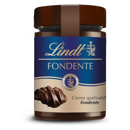 Vasetto di vetro di crema spalmabile Lindt Fondente con etichetta blu e marrone e ricciolo di cioccolato su sfondo bianco