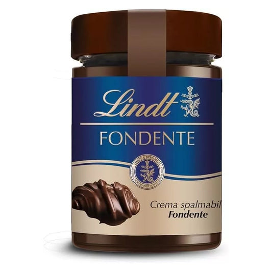 Vasetto di vetro di crema spalmabile Lindt Fondente con etichetta blu e marrone e ricciolo di cioccolato su sfondo bianco