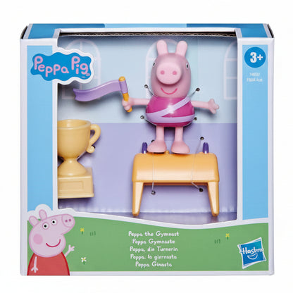 Confezione del giocattolo Peppa Pig La Ginnasta di Hasbro, con la statuetta del personaggio con body sportivo e nastro, la coppa e l'attrezzo inclusi nella scatola originale