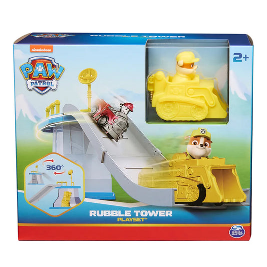 Confezione del playset Paw Patrol Rubble Tower di Spin Master, con la torre con rampa a 360 gradi e il veicolo giallo con Rubble inserito nella scatola originale
