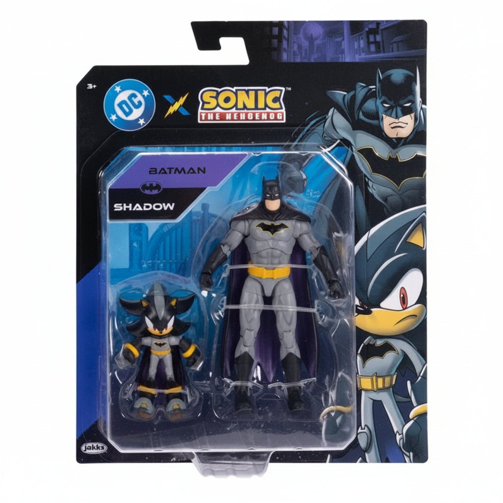 Action figure di Batman da 30 cm con costume grigio, nero e giallo accanto alla sua confezione originale DC Comicscrossover