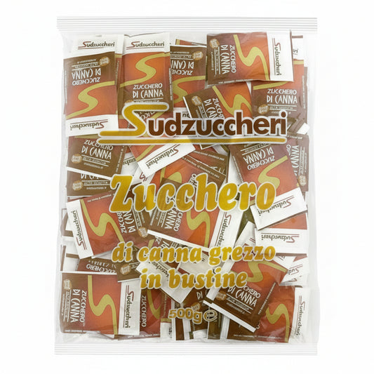 Confezione trasparente da 500g di zucchero di canna grezzo in bustine Sudzuccheri con scritte dorate su sfondo bianco
