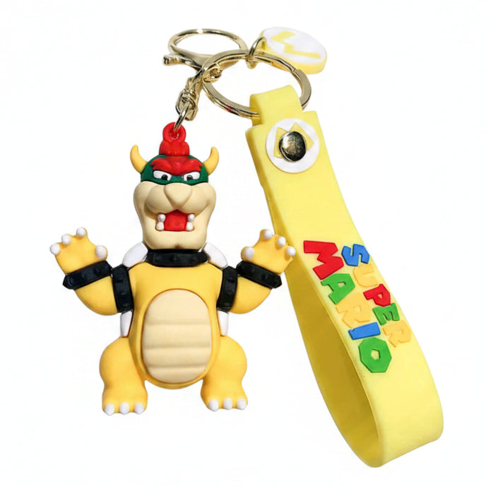 Portachiavi 3D di Bowser da Super Mario in silicone giallo e colorato con figura del personaggio e cordino con scritta Super Mario su sfondo bianco