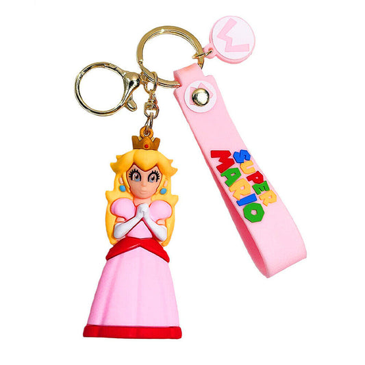 Portachiavi 3D della Principessa Peach da Super Mario in silicone rosa con figura del personaggio e cordino con scritta Super Mario su sfondo bianco