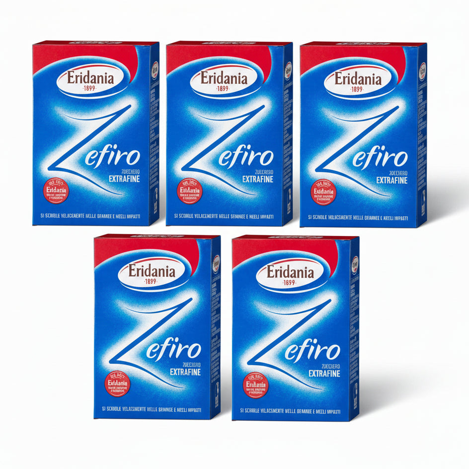 Confezioni blu e rosse multiple di Zucchero Zefiro Extrafine Eridania disposte su sfondo bianco